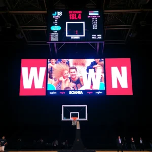 Basketball court with scoreboard celebrating a close win.